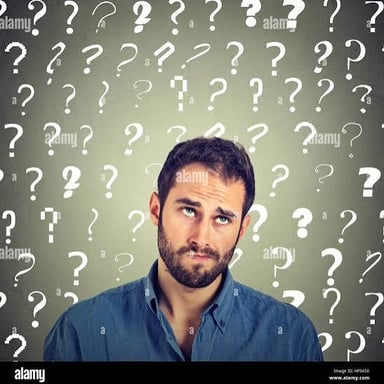 A person looking puzzled as they think over a question.