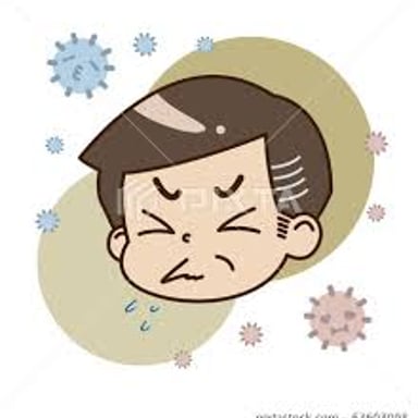 A person sneezing after encountering household dust.