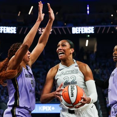 A’ja Wilson playing basketball for the Las Vegas Aces in a WNBA game.
