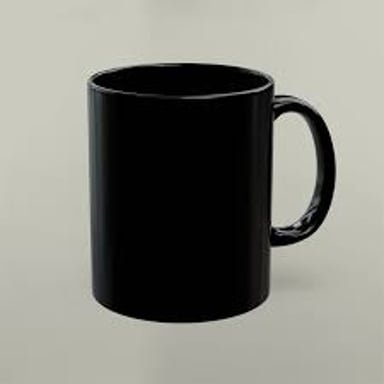 A mug filled with dark coffee, the sort someone might jokingly call mud.