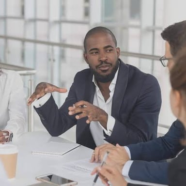 A group working together while one participant appears to dominate the conversation.
