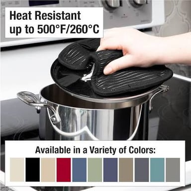 A hot cooking pot resting on a heat-resistant pad.