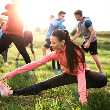 A physically fit person exercising outdoors.