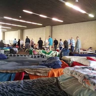 People entering a building that provides residential shelter.