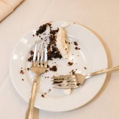 An empty plate after all the cake has been eaten.