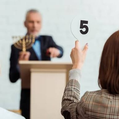An auctioneer opening a bid with an initial price