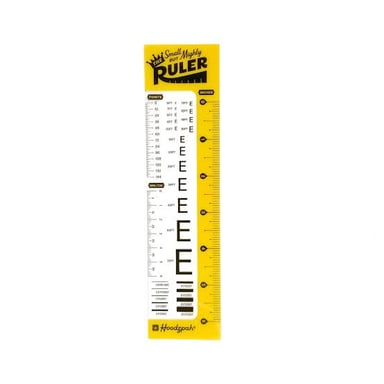 A typography ruler marked in picas and points beside a sample of printed text.