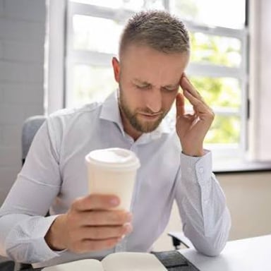 An energetic person holding a cup of coffee