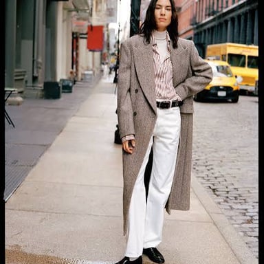 A warm coat worn as an outer layer in winter.