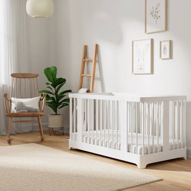 A baby crib set up in a nursery.