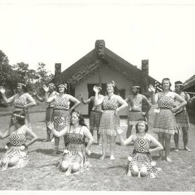 A Māori kapa haka group performs a coordinated chant and movement.