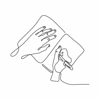 A hand using a pen to draw on paper