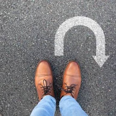 A person or vehicle straying onto the wrong route.