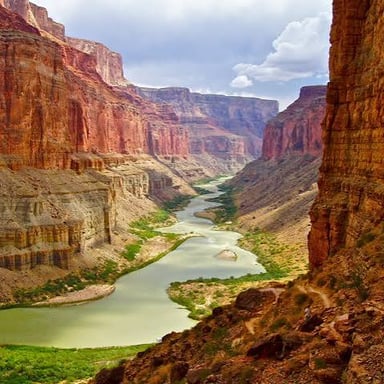 A canyon with exposed rock layers carved by erosion.