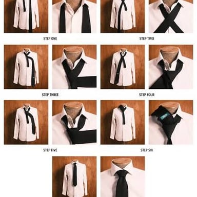 A person wearing a knotted necktie with a formal suit.