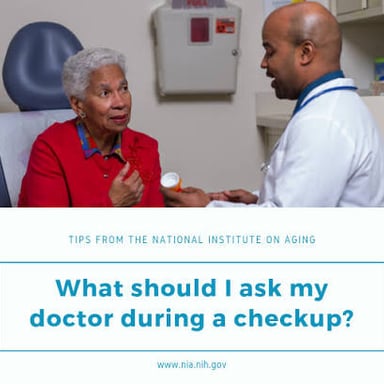 A doctor examining a patient’s throat during a checkup.