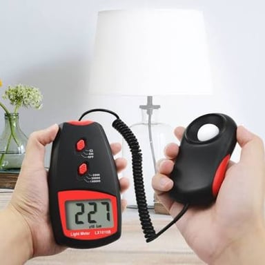A light meter displaying a lux measurement in an illuminated room.