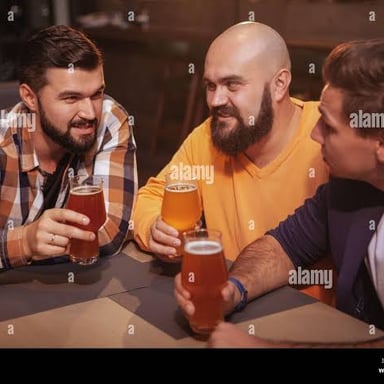 Friends enjoying conversation together in a pub.
