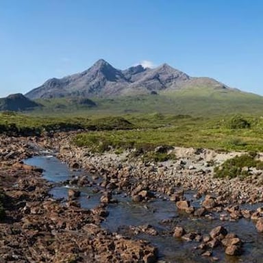 The jagged Cuillin mountain range rising above the landscape on Scotland’s Isle of Skye.