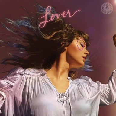 The album covers for Taylor Swift’s Fearless and Lover, two releases associated with different eras of her career.