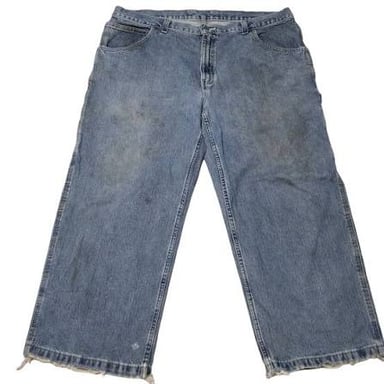 A pair of visibly worn, faded blue jeans.