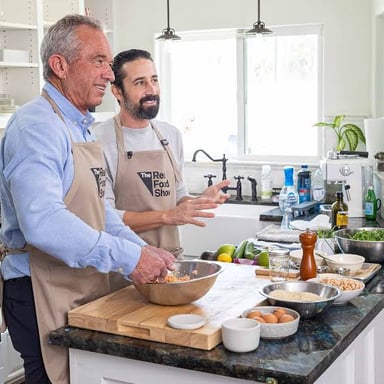A chef preparing food while presenting a cooking-show demonstration.