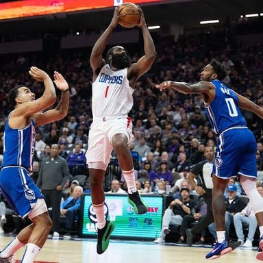 Los Angeles Clippers players competing on a basketball court.