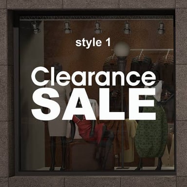 A store window displaying a clearance sale sign.