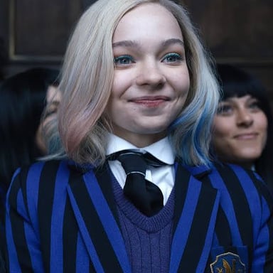 Enid Sinclair, Wednesday Addams’s colorful werewolf roommate in Wednesday.